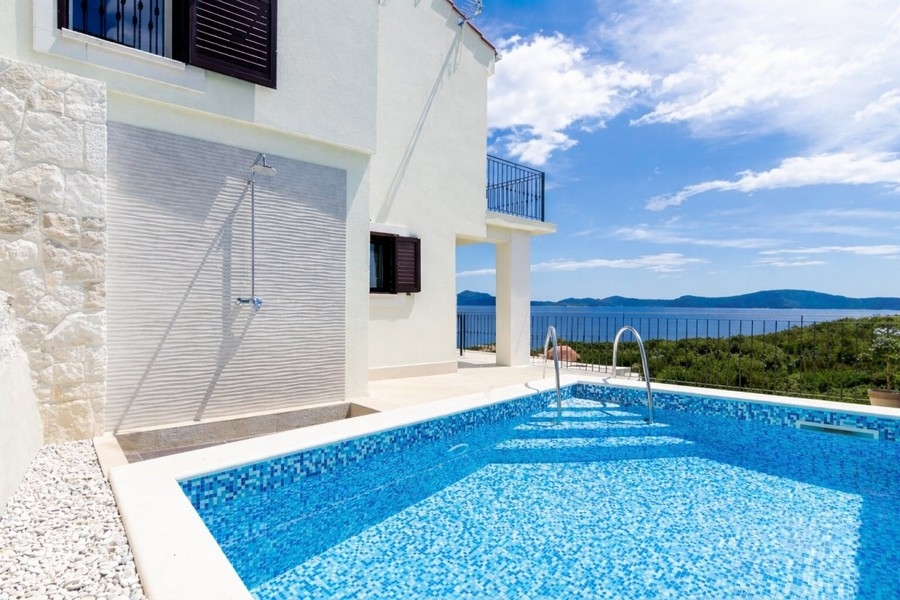 Buy a house with a pool in Croatia.