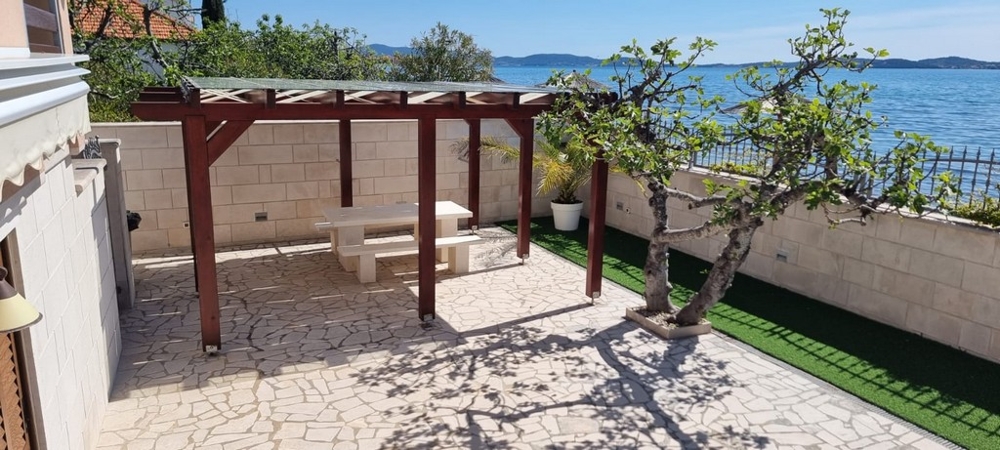 Terrace with seating area and views of the coast and sea in Bibinje