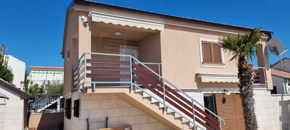 House with two residential units and external stairs in a beach location in Bibinje Dalmatia