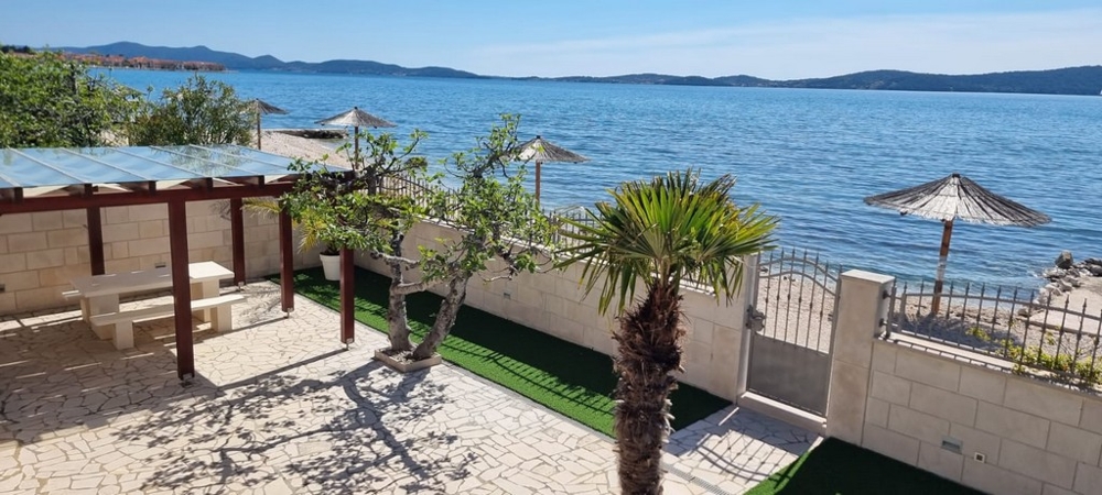Terrace with pergola and direct access to the beach and sea views in Bibinje Croatia