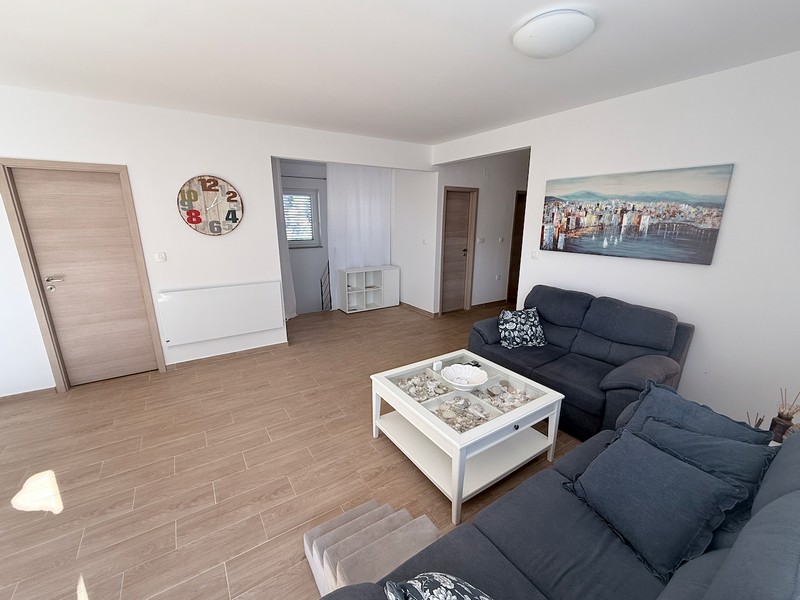 Open living area with seating area and bright interior design in the house