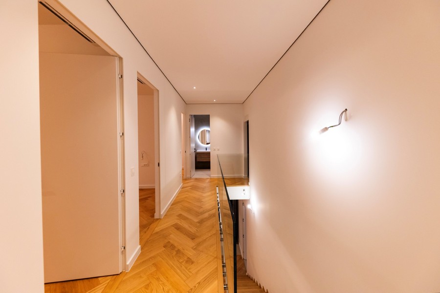 Modern hallway area with access to several rooms