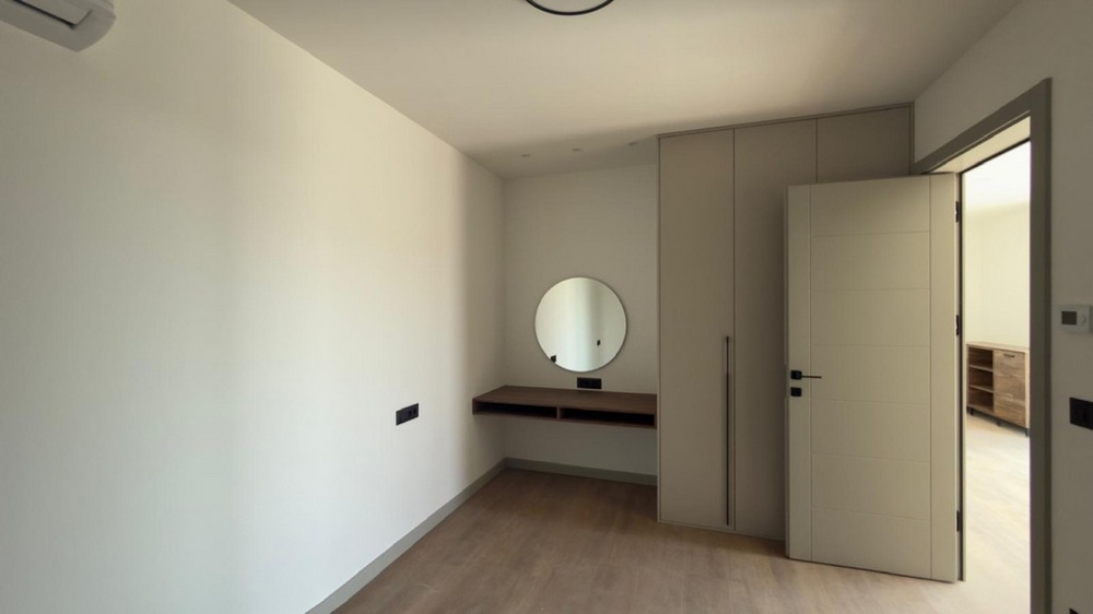 Bedroom with built-in wardrobe and work area