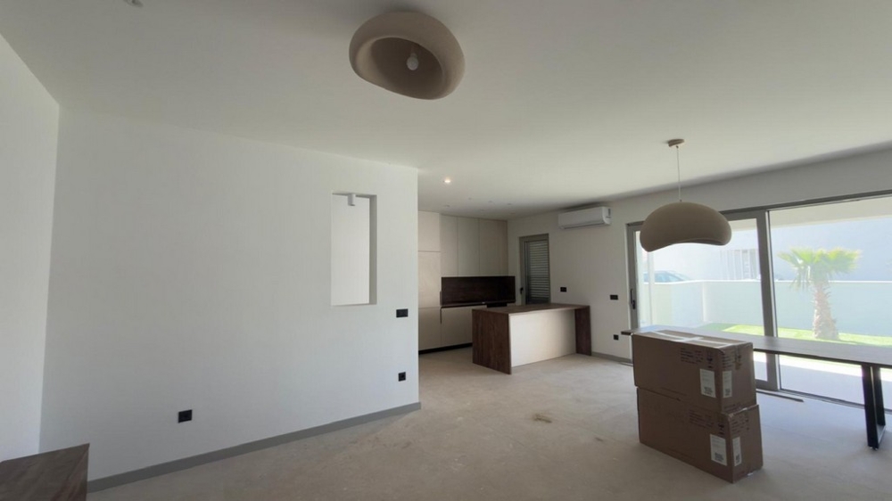 The living area with a view of the kitchen