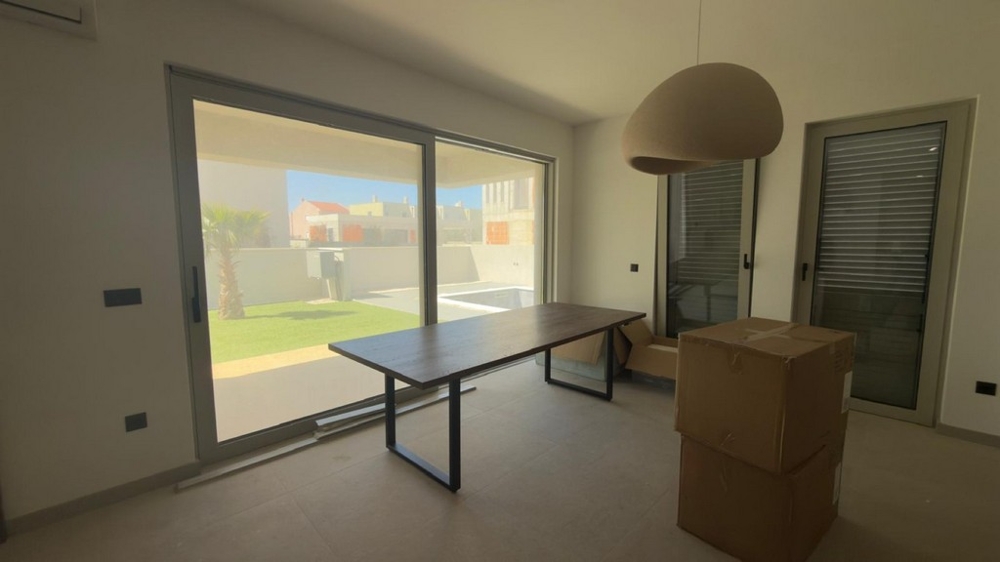 Dining area with a view of the garden and large windows