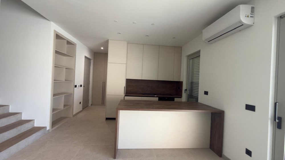 Modern fitted kitchen with cooking island and plenty of storage space