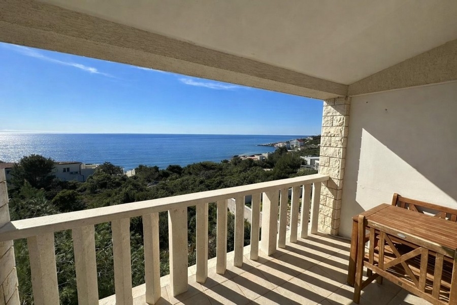 Balcony with sea views and seating area in a quiet location