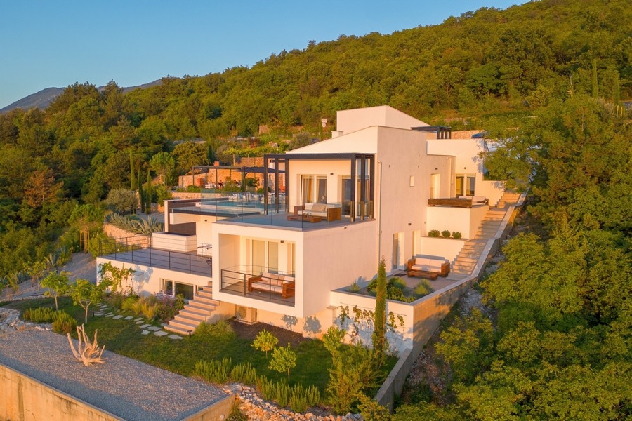 Terrace areas with glass railings and sea views