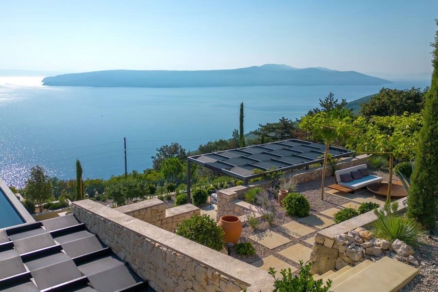 Gardens with natural stone walls and sea views