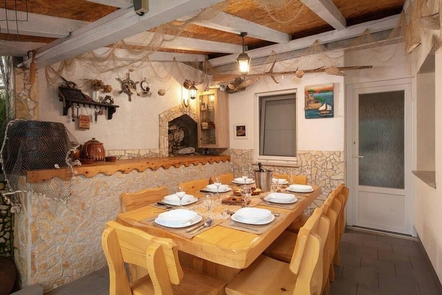 Rustic tavern with a large wooden table and a traditional atmosphere
