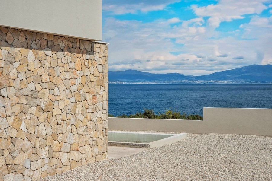 Outdoor area with natural stone facade and sea views