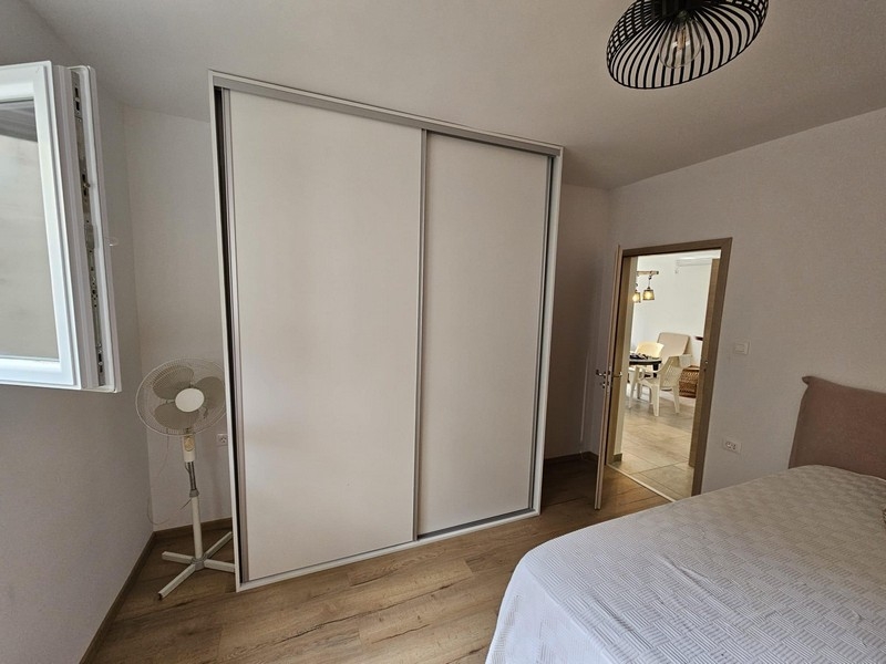 Bedroom with wardrobe and access to the living area
