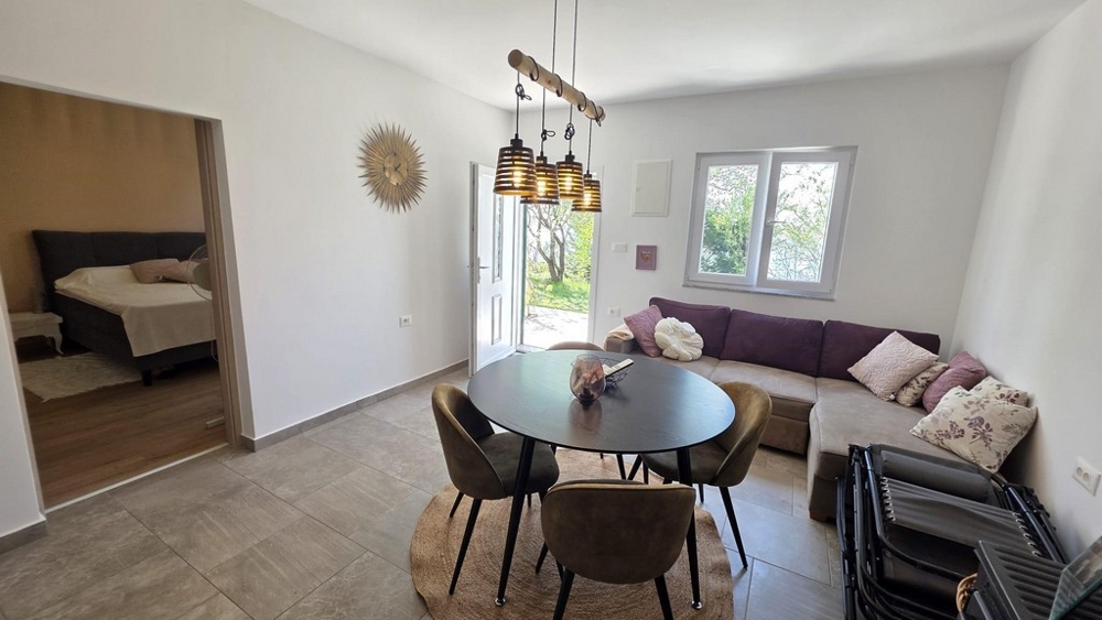 Living area with sofa and dining table