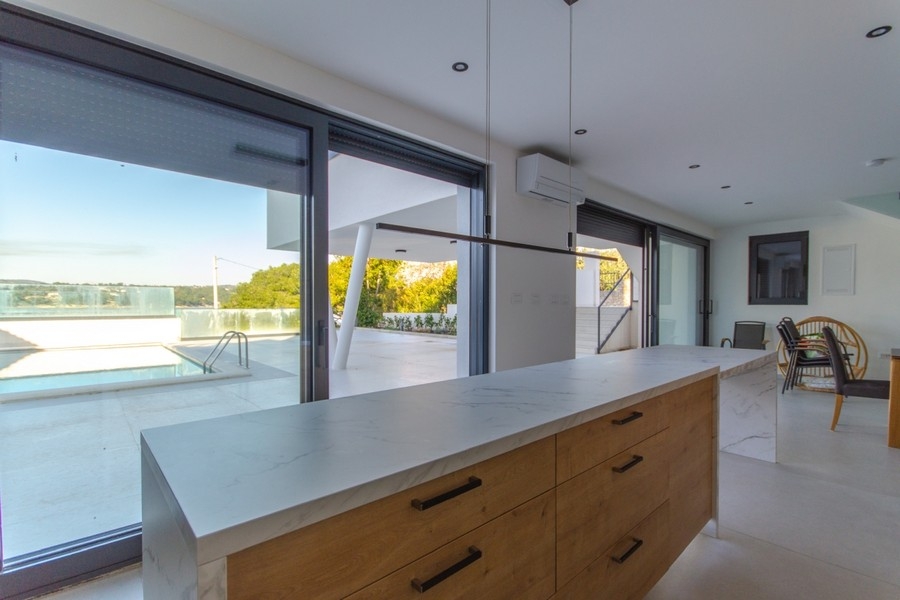 Open kitchen overlooking the property's pool.