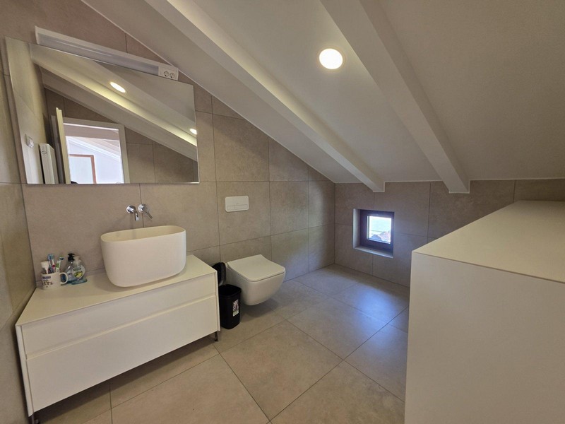 Modern bathroom in the attic with natural light