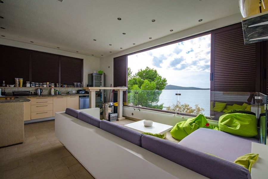 Living area with open kitchen and sea views