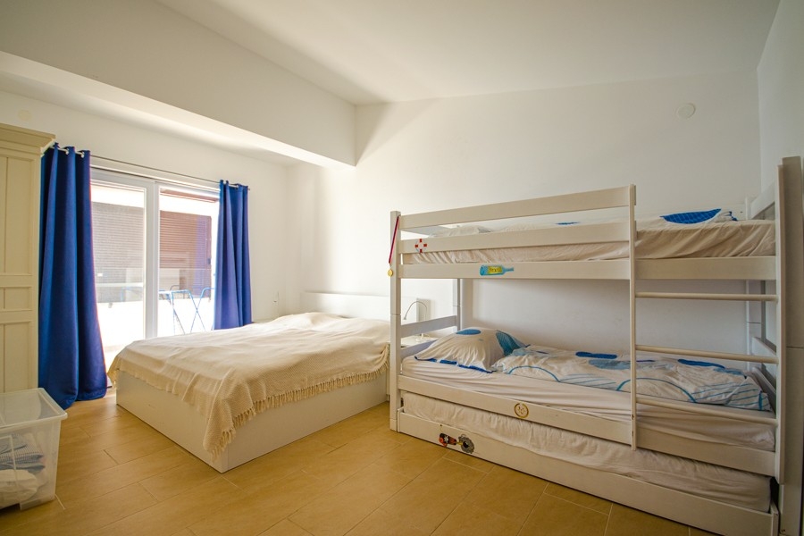 Bedroom with double bed and bunk bed