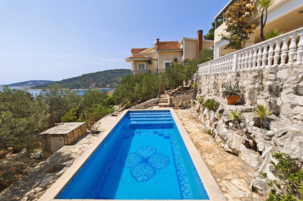 Pool with sea views and natural stone terrace