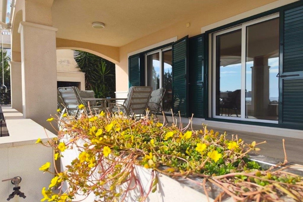 Terrace with seating area and sea views