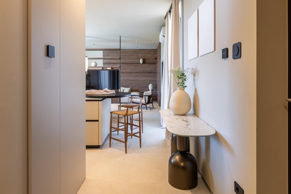Hallway with stylish furnishings and access to the living area