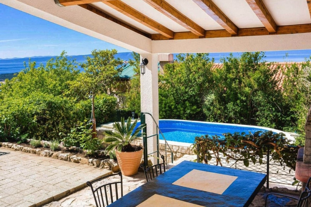 The house has a swimming pool in the garden.