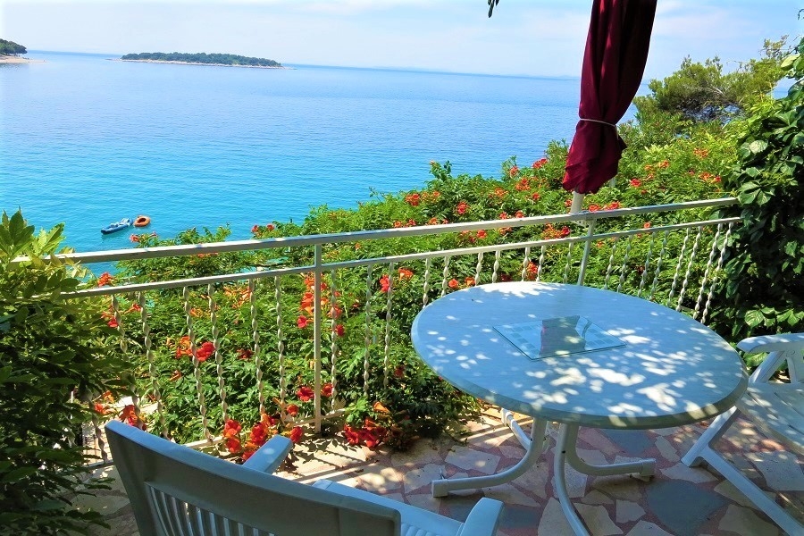 Terrace with sea views and seating area under a parasol