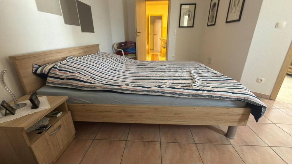 Bedroom with double bed and access to the hallway