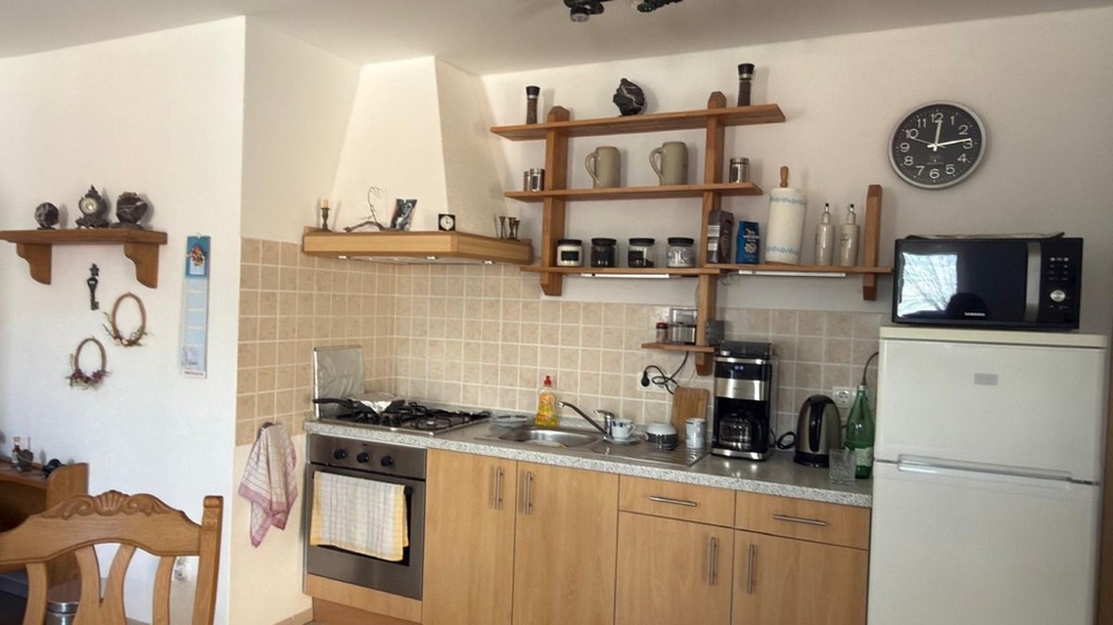 Kitchen with built-in appliances and work surface