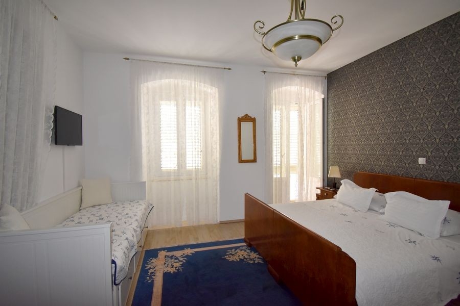 Bedroom with double bed and balcony access