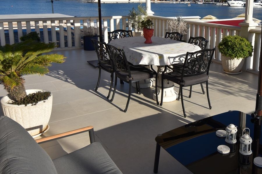 Covered patio with waterfront seating area