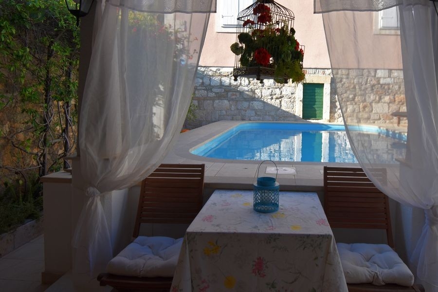 Covered dining area by the pool