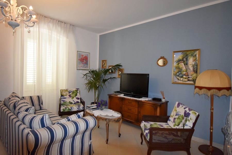 Living area with TV and seating furniture