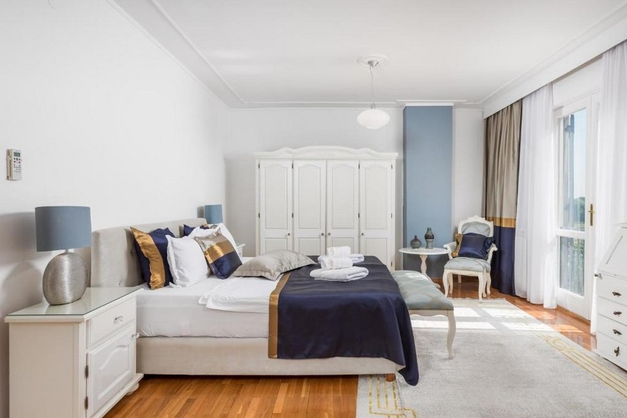 Bedroom with double bed and balcony access