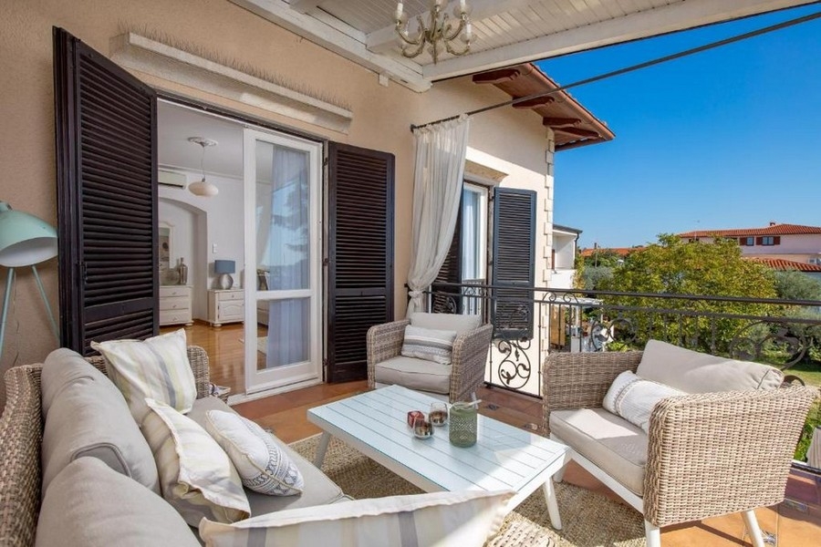 Terrace with seating area and view of the greenery