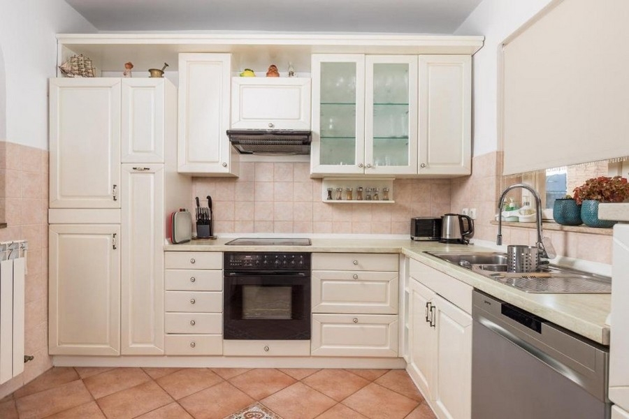 Kitchen with built-in appliances and work surface
