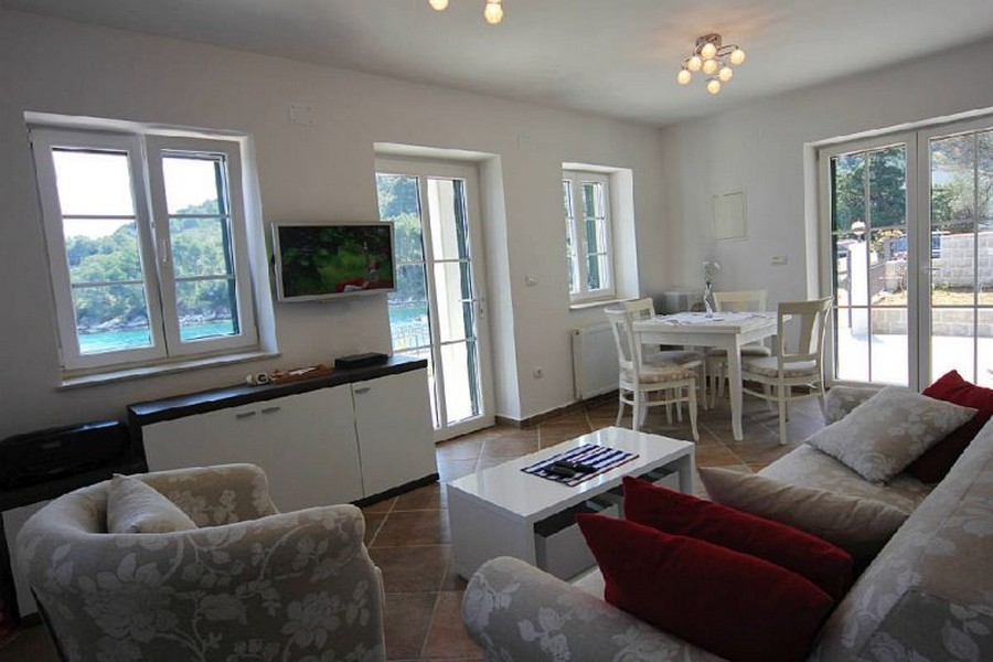 Bright living area with large windows and sea views