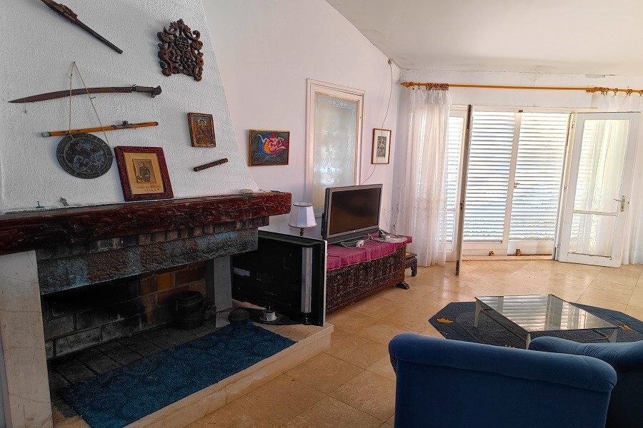 Living room with seating area and patio doors