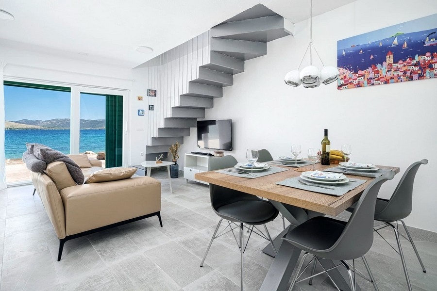 Modern living area with sea views and access to the terrace
