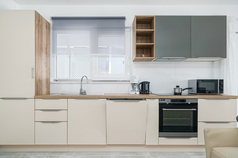 Modern fitted kitchen with electrical appliances