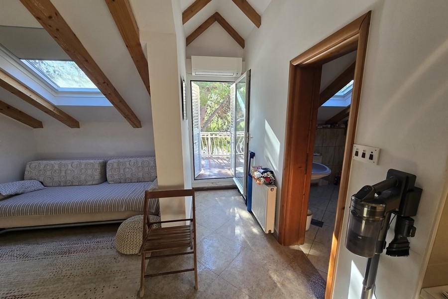 Attic with living area and balcony access
