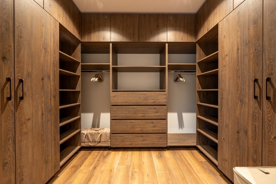 Walk-in closet with built-in cupboards