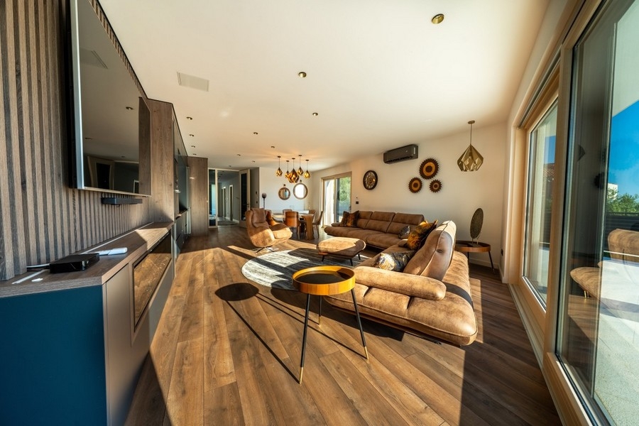 Modern living area with seating area and TV wall