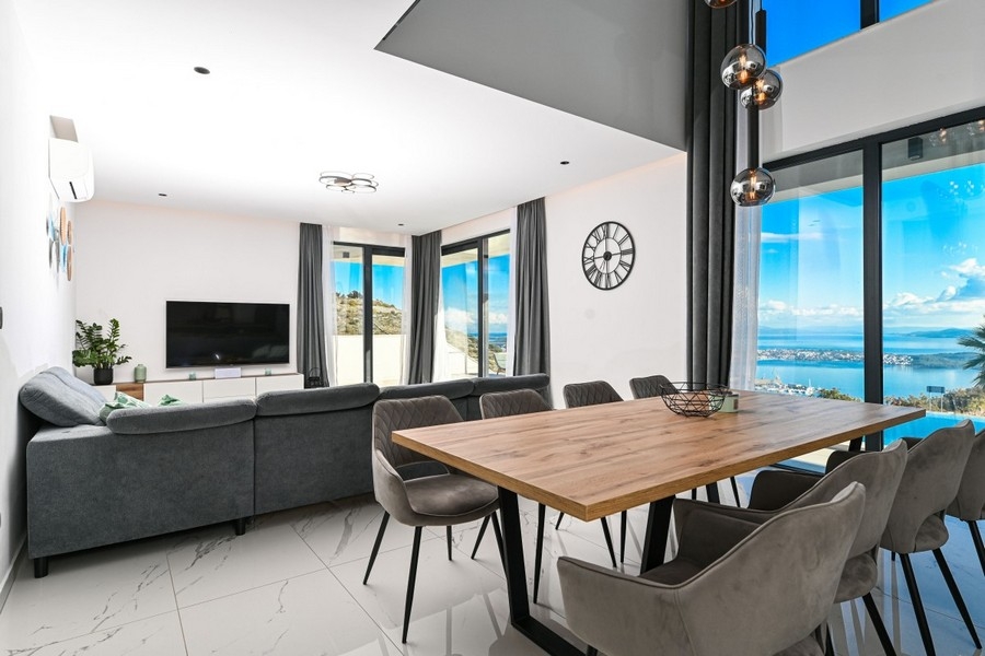 Open living area with dining table and sea views