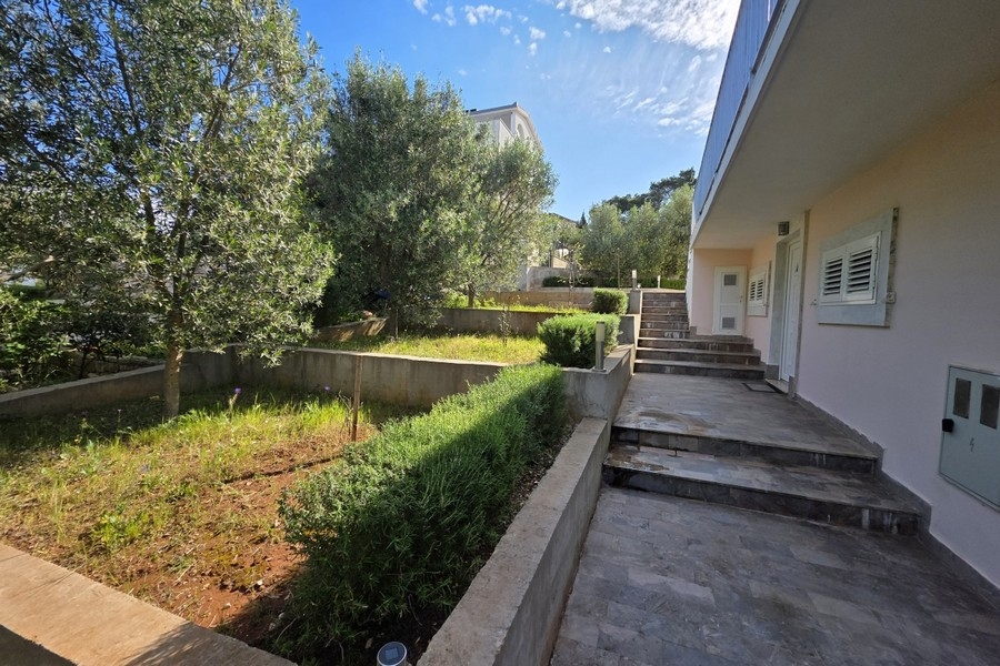 House entrance with terrace and garden area