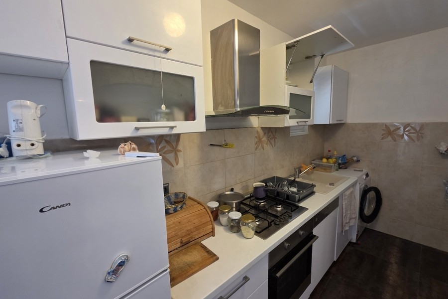 Kitchen with built-in appliances