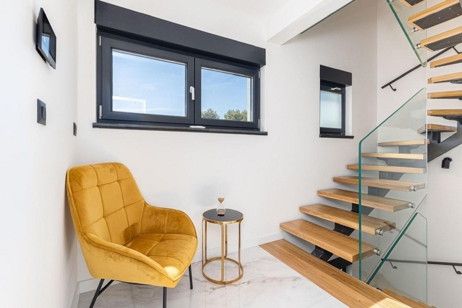 Staircase with glass railings and modern design
