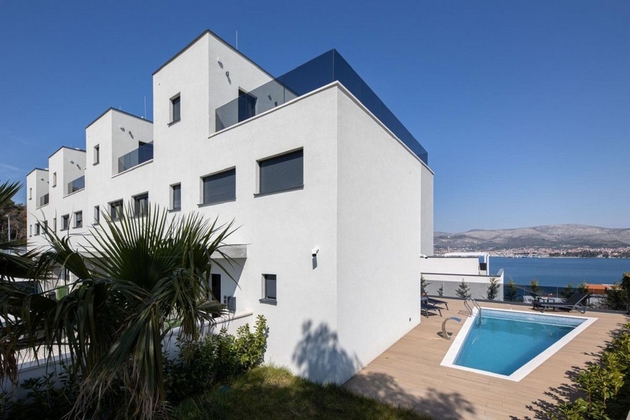 Modern new building complex with pool and sea views