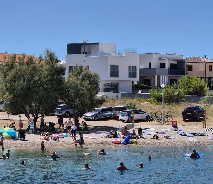 Modern villa near the beach on the island of Vir with contemporary architecture.
