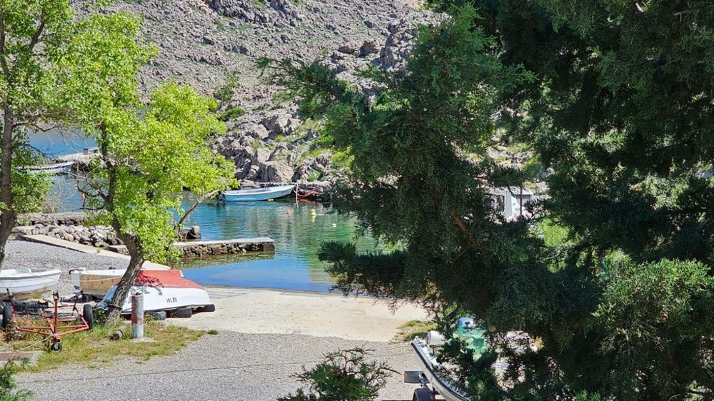 View of the sea shore with a boat dock.