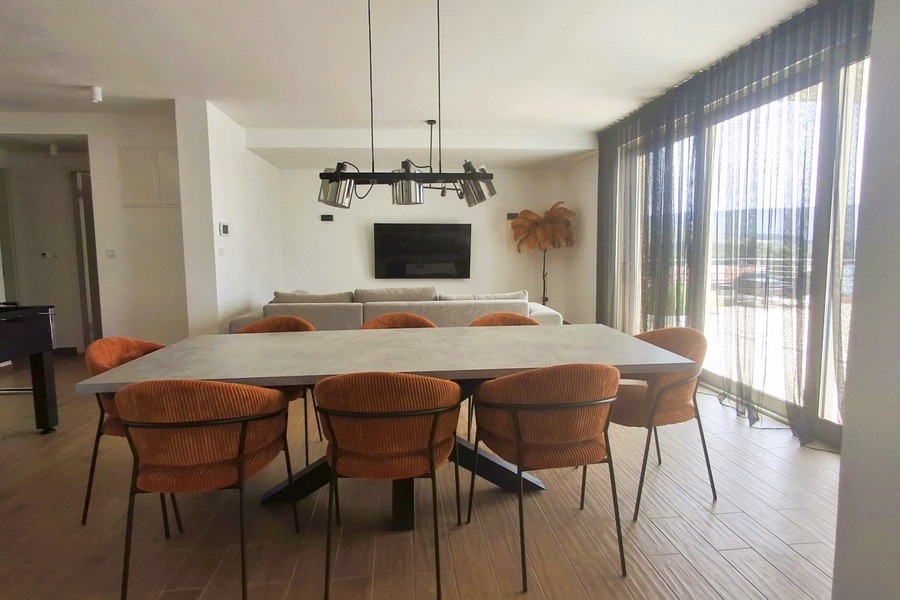 Bright dining area with large windows and sea views